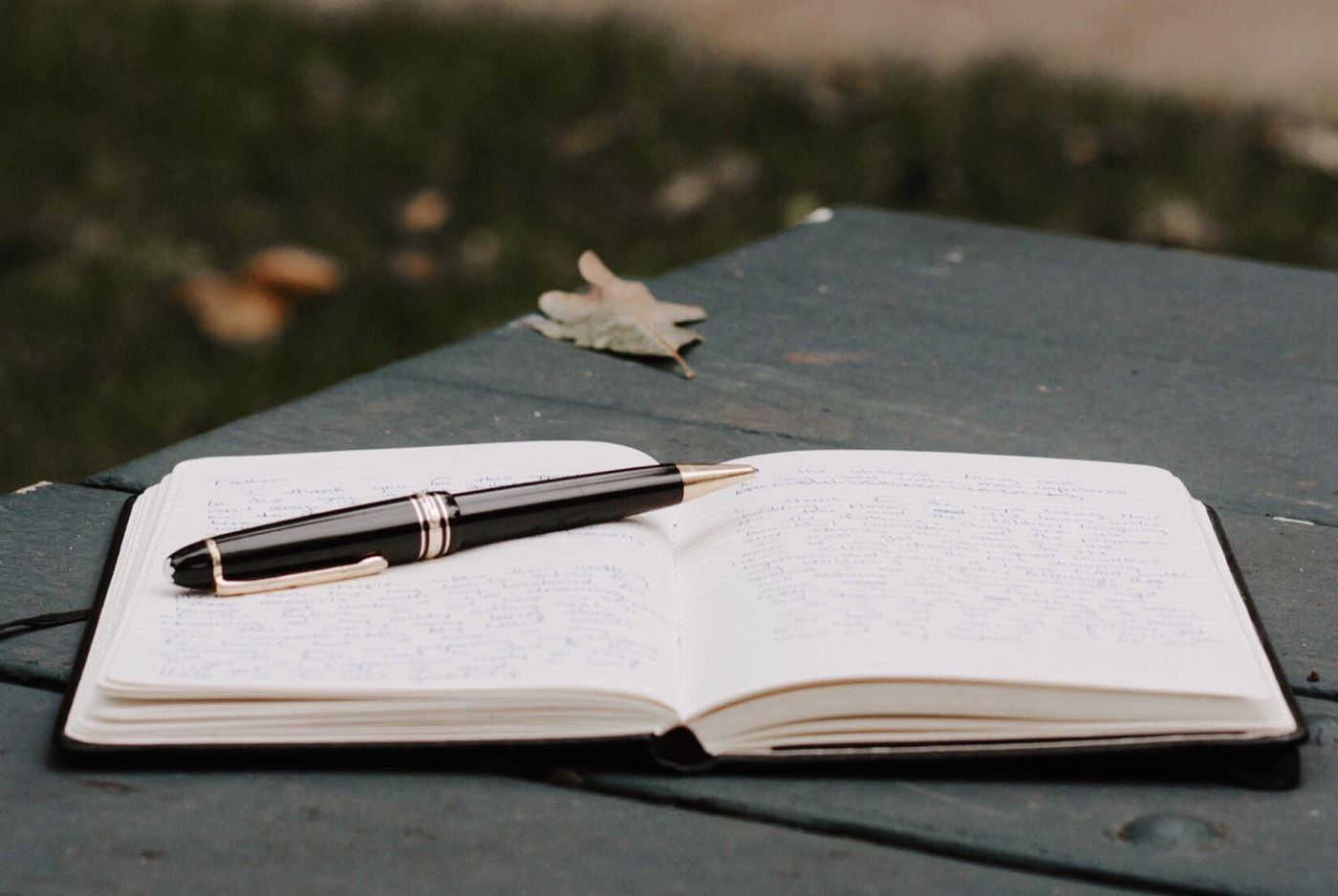 Open journal and pen on a table, used for grief journaling between therapy sessions with a Berkeley therapist